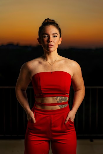 Woman in Red Strapless Crop Top and Red Bottoms