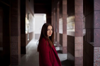 Woman in Red Suit Jacket Looking at Right