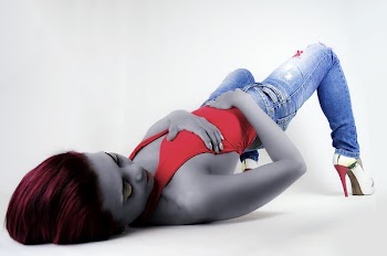 Woman in Red Top Laying on Floor