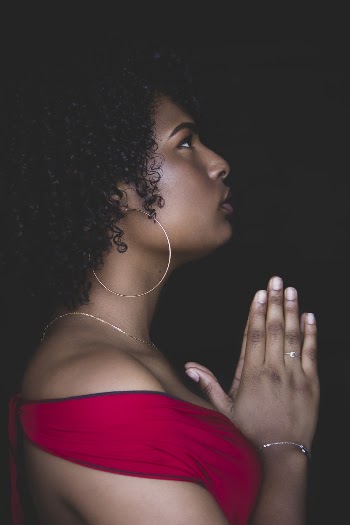 Woman in Red Top Praying