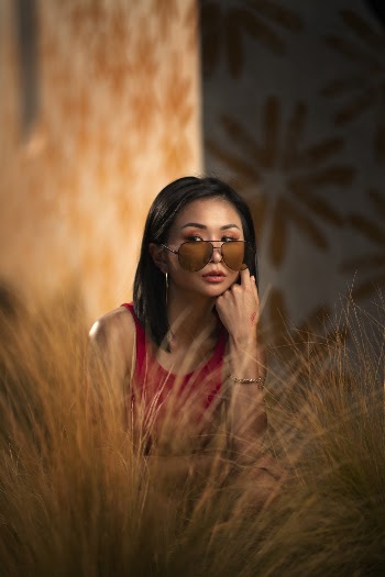 Woman in Red Top Wearing Sunglasses