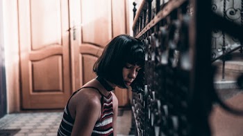 Woman in Red, White, and Black Striped Spaghetti Strap Top