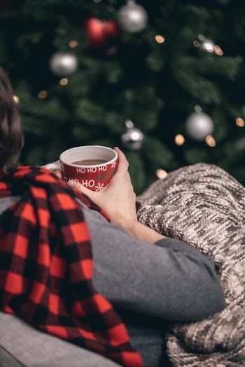 Woman In Scarf Drinking Hot Chocolate