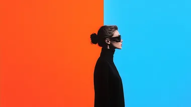 Woman in sunglasses against vibrant wall exploring self-perception Woman in sunglasses against vibrant wall exploring self-perception