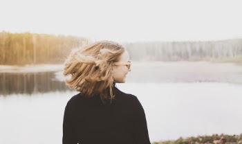 Woman in Sunglasses and Black Jacket