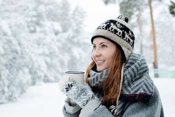 Woman in Sweater Holding Mug