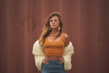 Woman In  Tank Top Standing