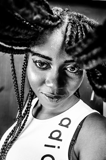 Woman in Tank Top With Braided Hair