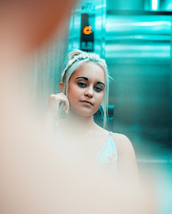 Woman in Teal Floral Dress