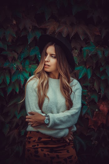 Woman in Teal Sweatshirt Crossing Arms