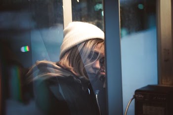 woman in telephone booth