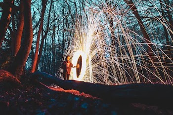 woman in the middle of forest steelwool photo