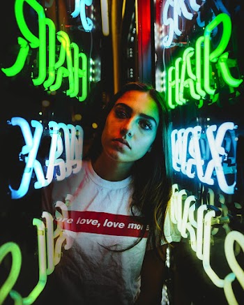 Woman in the Middle of Neon Signage