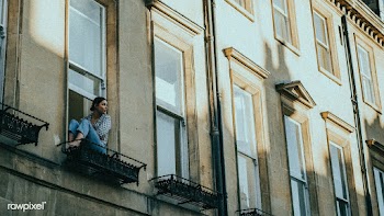 Woman in the window of her apartment during self quarantine due to the.. | Free  photo - 2332525