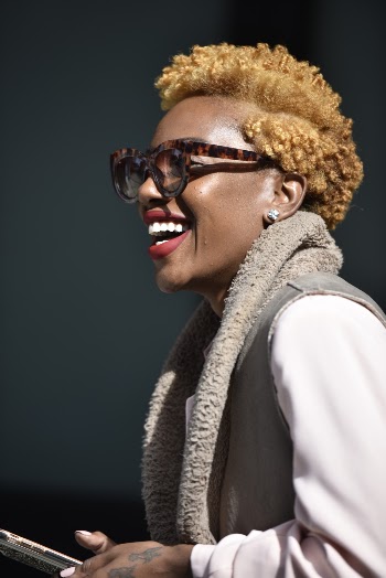 Woman in Tortoiseshell-framed Eyeglasses and Gray Vest