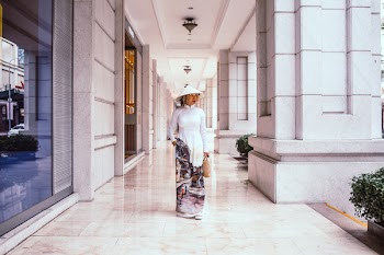Woman In Traditional Dress Standing On Hallway