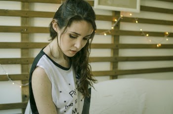 Woman in White and Black Sleeveless Top Inside Room