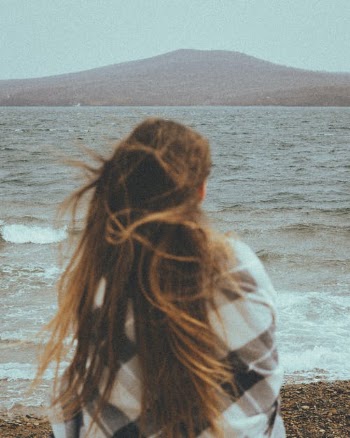 Woman in White and Blue Shirt Standing on Beach · Free Stock Photo