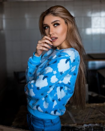 Woman In White And Blue Sweatshirt