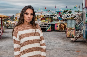 Woman In White And Brown Striped Sweater