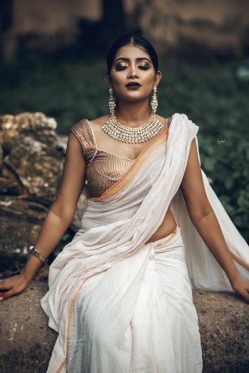 Woman In White And Gold Ghagra Choli Dress