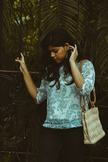 Woman In White and Gray Floral Top