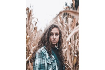 Woman in White and Green Flannel Shirt