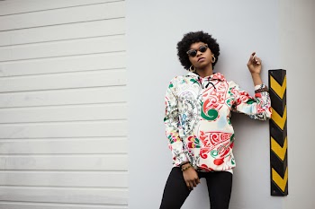 Woman in White and Red Floral Jacket