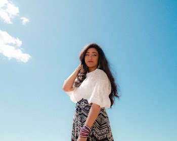 Woman In White Blouse And Black Skirt