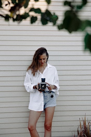Woman In White Button-up Collared Shirt