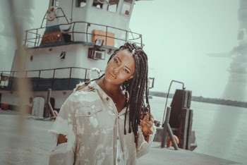 Woman in White Button Up Shirt Standing Near White Ship