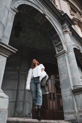 woman in white coat standing
