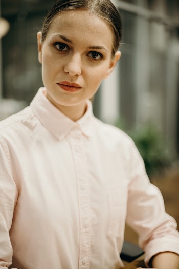 Woman in White Collared Shirt