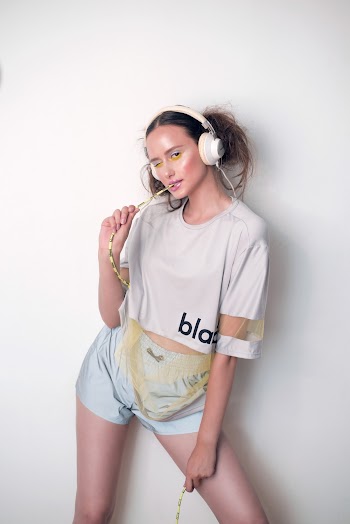 Woman in White Crew-neck T-shirt and White Shorts