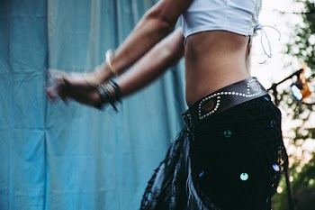 Woman in White Crop Top While Dancing