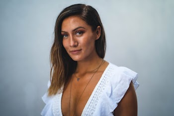 Woman In White Deep V-neck Dress