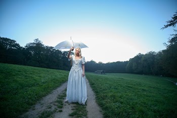 Woman in White Dress Holding White Umbrella