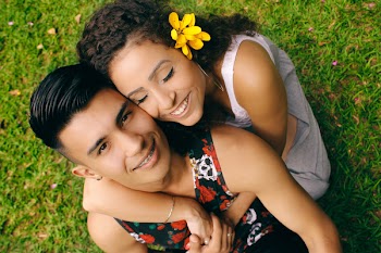 Woman in White Dress Hugging Man in Tank Top