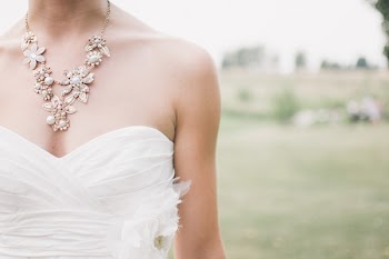 Woman in White Dress Wearing Gold Chunky Necklace during Daytime