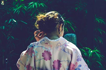 Woman in White Floral Top Near Green Leafed Trees
