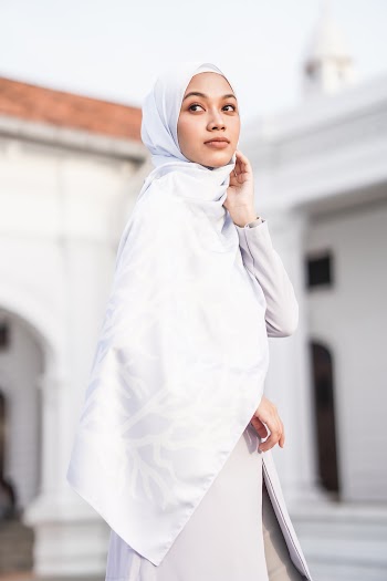 Woman in White Hijab Standing Near Building