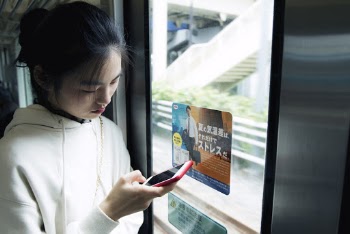 Woman In White Hoodie Using Smartphone