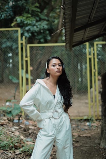 Woman In White Jumpsuit