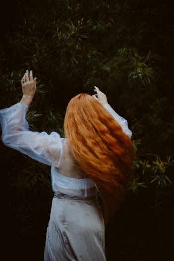 Woman in White Long Sleeve Shirt Holding Cigarette Stick · Free Stock Photo