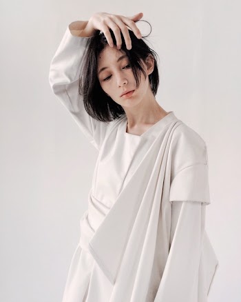 Woman in White Long-sleeved Dress