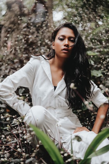 Woman in White Long-sleeved Jumpsuit