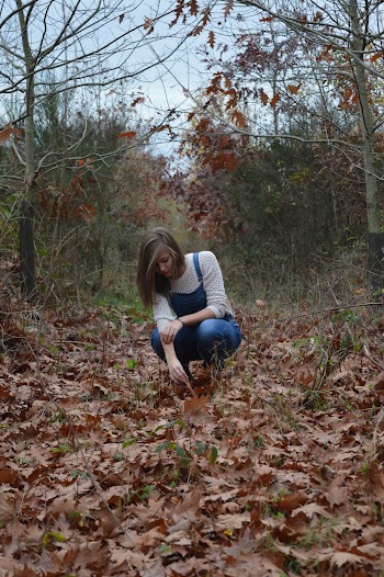 Woman In White Long Sleeved Shirt Sitting On Pathway
