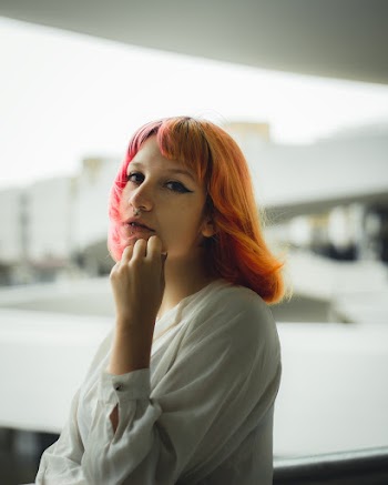 Woman in White Long-sleeved Top on Selective Focus Photography