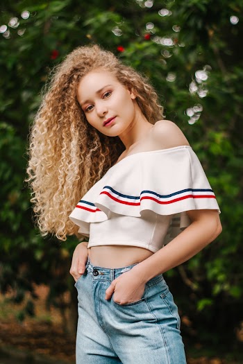 Woman in White Off-shoulder Crop Top on Selective Focus Photography