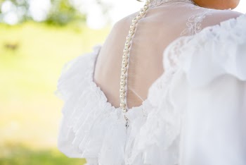 Woman in White Off-shoulder Dress